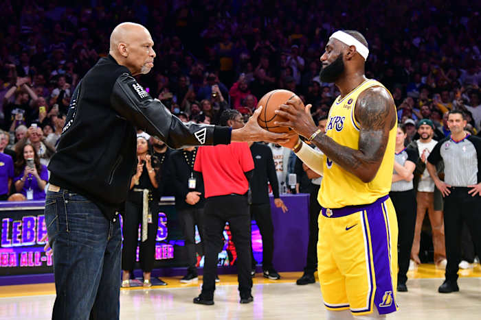 Los Angeles Lakers forward LeBron James (6) takes a ball from Kareem Abdul-Jabbar after breaking the record for all-time scoring in the NBA during the third quarter against the Oklahoma City Thunder at Crypto.com Arena on Feb. 7, 2023.